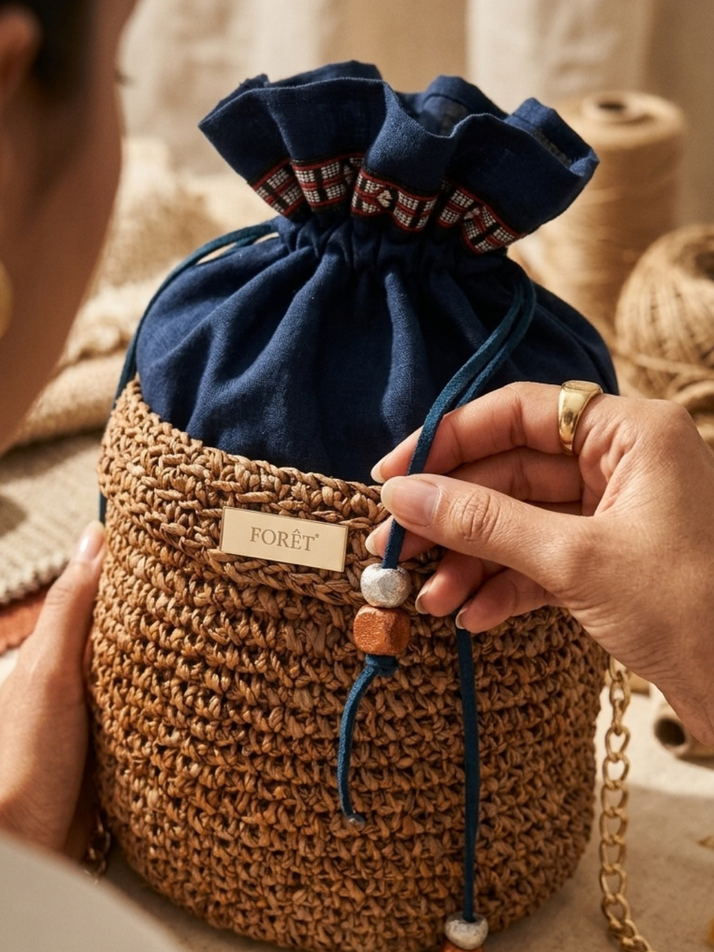 Artisan detail of handcrafted eco-friendly banana bark bag with tamarind seed accents